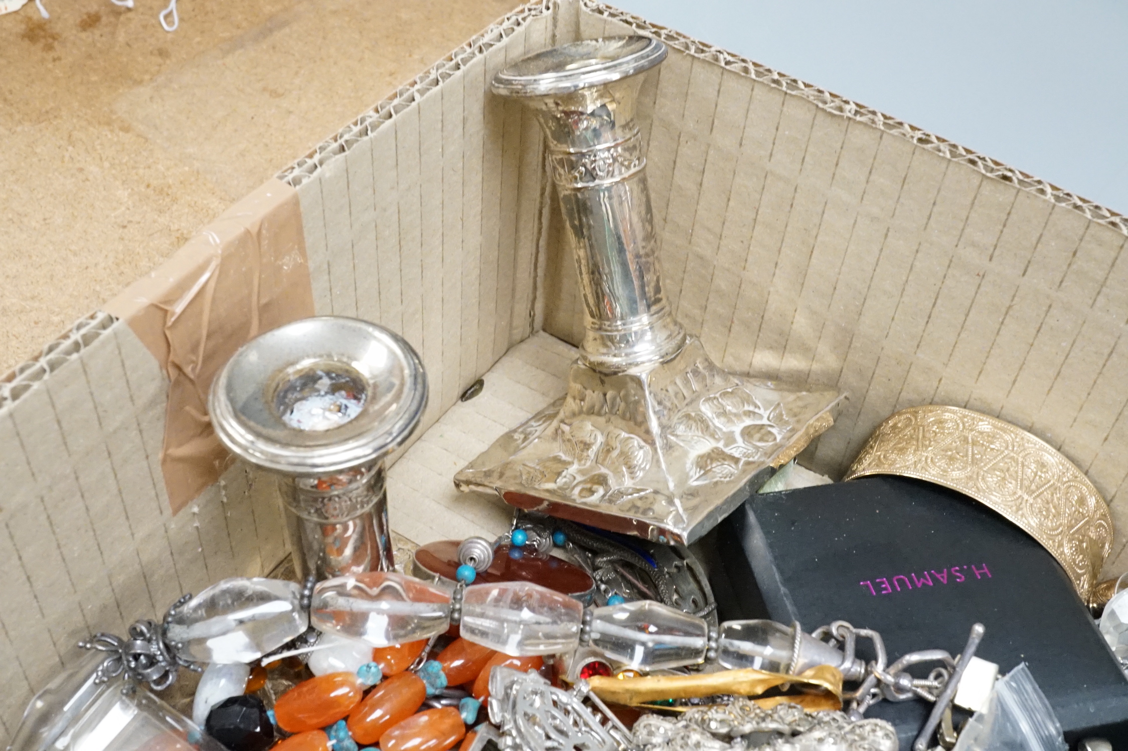 A quantity of assorted jewellery, including silver, white metal and costume and a pair of silver mounted dwarf candlesticks(a.f.).